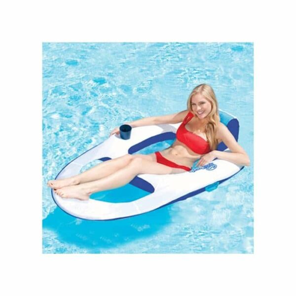 A woman in a red bikini smiles and reclines comfortably on the Spring Float Recliner Lounge, a white and blue inflatable pool float with a cup holder, as she floats in a clear blue swimming pool.