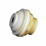 The Rapid Flow Return Fitting Complete is a beige and gray cylindrical plastic component with ridges and a central hole, resembling a mechanical or plumbing part, shown isolated on a white background.