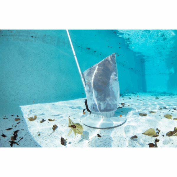 The VOLT RECHARGEABLE LEAF VAC is removing debris and leaves from the bottom of a swimming pool filled with clear blue water.