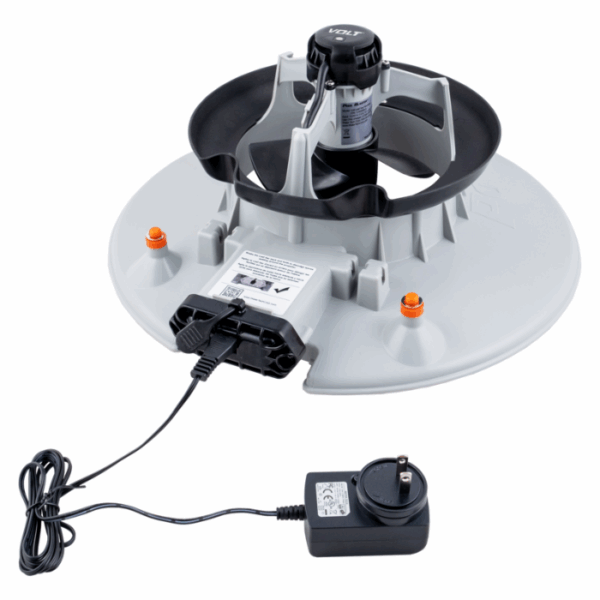 A gray VOLT RECHARGEABLE LEAF VAC with a central rotating dispenser, control panel, power adapter, and black bowl, shown on a white background.