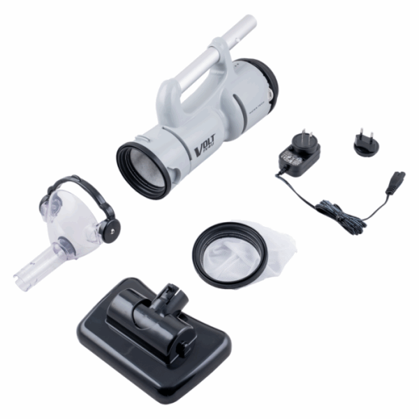 The VOLT FX-4 LI RECHARGEABLE VAC is shown disassembled on a white background, featuring its main body, clear nozzle attachment, filter bag, flat brush head, and a power adapter with interchangeable plugs.