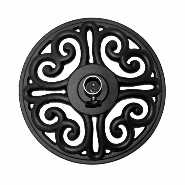 The Medici Umbrella Base in black features a round, decorative metal design with symmetrical scrollwork and a central circular fastener, shown against a plain white background.