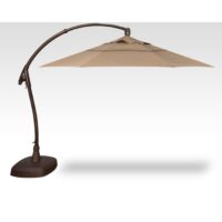 The Cantilever Brz/Sesame 11 is a large tan patio umbrella with a dark curved metal stand and sturdy base, casting shade on a light background.