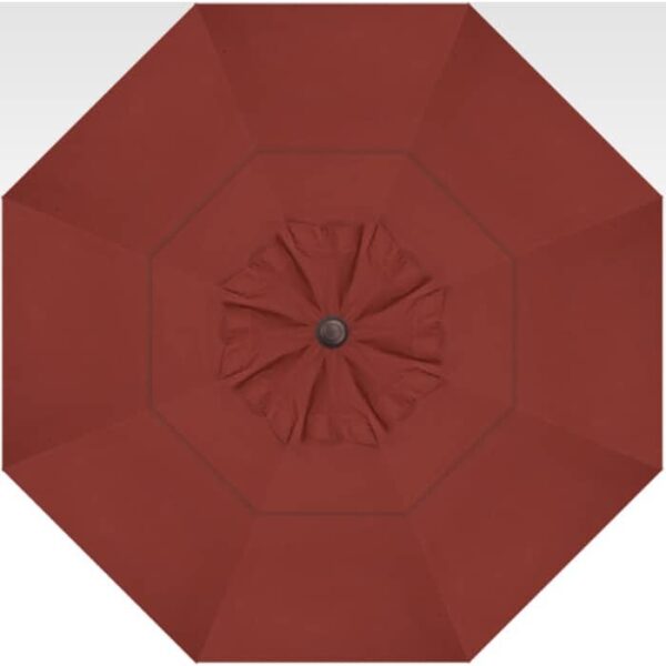Top-down view of the 13 Octagon Cantilever - Auburn, a large red patio umbrella with a central hub and radiating fabric panels.