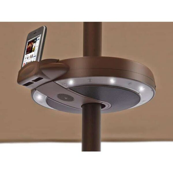 The Serenata LED Umbrella Light with Stereo is a circular brown device with built-in speakers and lights that fits around a vertical pole beneath an umbrella canopy.