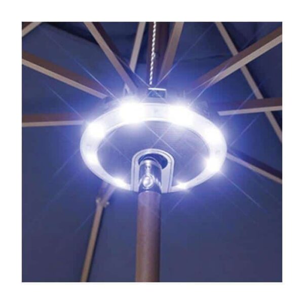A close-up of the Serenata LED Umbrella Light with Stereo, mounted on a patio umbrella pole and brightly illuminating the umbrella ribs with white light.