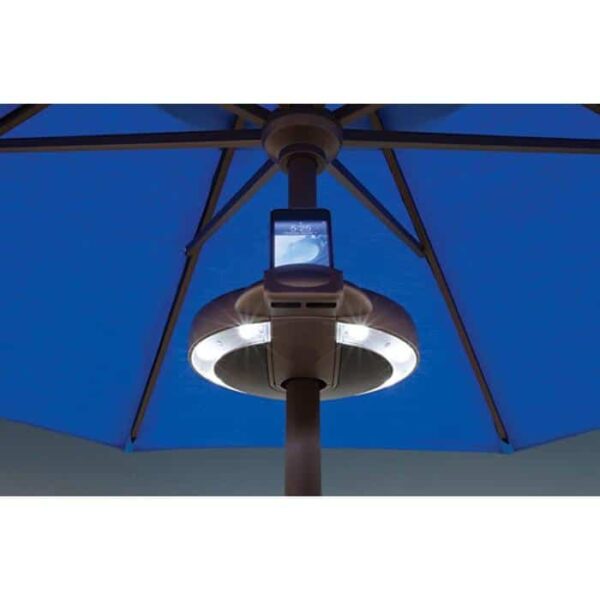 Close-up of a blue patio umbrella featuring the Serenata LED Umbrella Light with Stereo, which is attached around the pole and holds a smartphone facing outward.