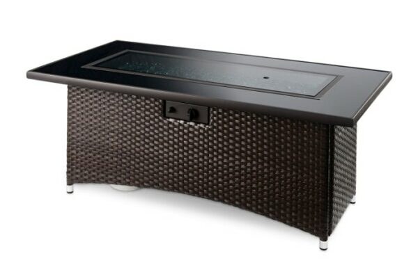 The Montego Firepit Table is a rectangular outdoor fire pit with a woven dark brown base, black tabletop, glass-covered center fire area, and front control knob.