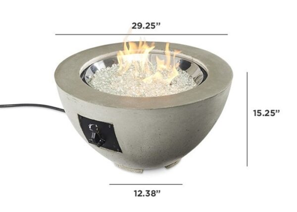 The Cove Gas Firepit Bowl 20 is a round tabletop fire bowl with glass rocks and visible flames. It measures 29.25W x 15.25H x 12.38D and features a control knob and power cord on one side.
