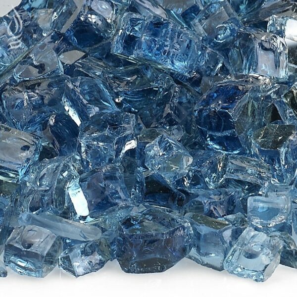 A close-up of 1/2 Fierglass Pacific Blue shows shiny, irregularly-shaped blue glass chunks, resembling ice cubes, scattered on a white background. Each bag contains 10 lbs.