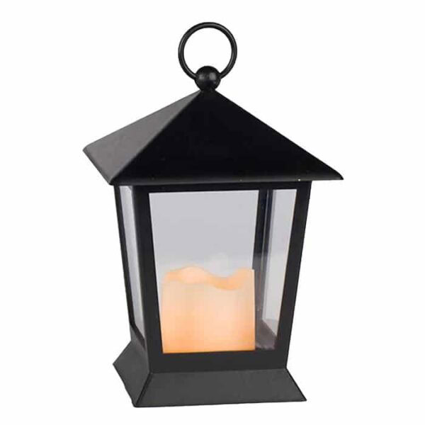 The Square Black Plastic Lantern features a pyramid-shaped top, clear panels, and a ring handle. Inside is a lit cream-colored candle that creates a warm glow.