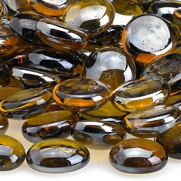 A 10 lb. pile of Caramel Luster Firebeads features smooth, glossy amber and dark brown glass pebbles with transparent, rounded surfaces that beautifully reflect light.