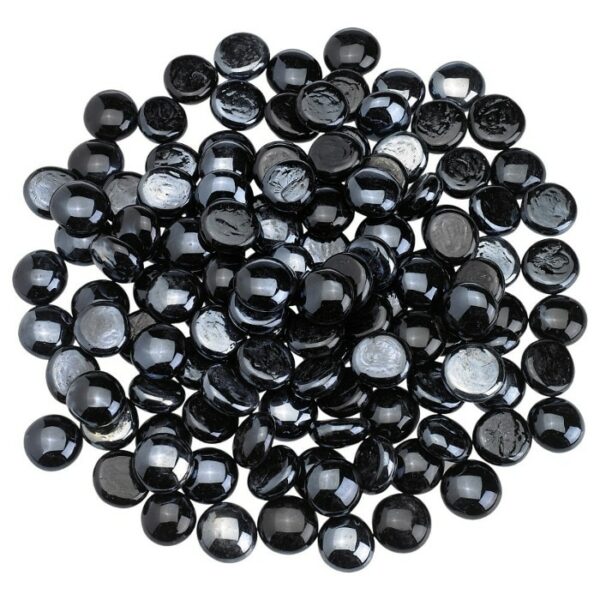 A pile of Twilight Luster Firebeads - 10 Lbs. is scattered closely together on a white background, displaying their shiny, round black glass appearance.