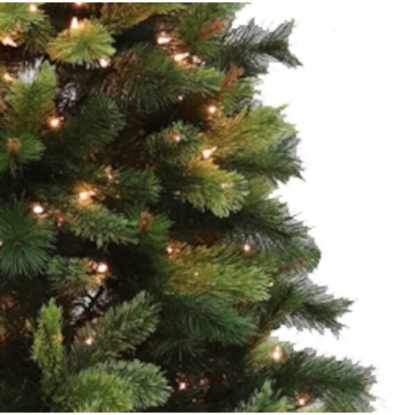 Close-up of the 6 Santa Fe Pine (C) artificial Christmas tree, featuring green branches adorned with small white string lights, set against a plain white background.