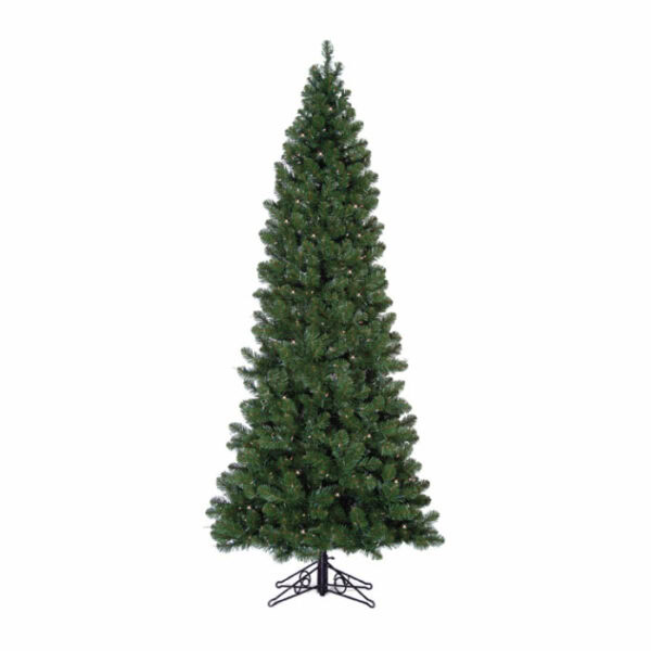 The 6.5 Pencil Pine Green Clear Lights tree stands tall on a metal stand against a white background. Its dense, green branches are undecorated, showcasing an artificial Christmas tree perfect for any setting.