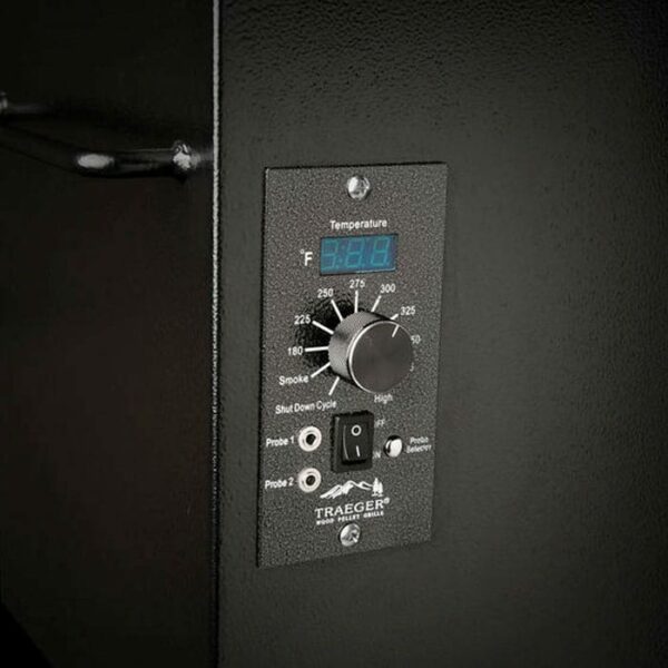 Close-up of the Pro Series 34 Grill - Bronze digital controller featuring a temperature dial, digital display, switches, and probe ports on the side of this black grill.