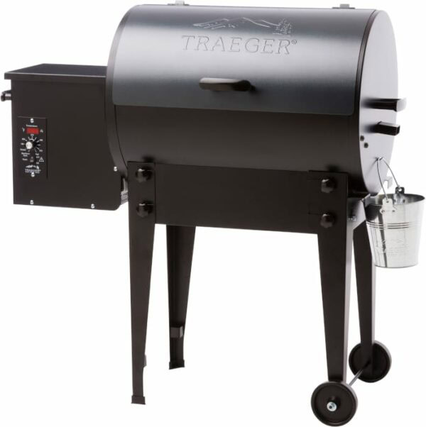 The TRAEGER-Pro Series 20 Blue wood pellet grill features a blue barrel-shaped lid, left-side control panel, two sturdy legs with wheels, and a small metal bucket on the right.