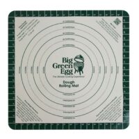 The Pizza Rolling Mat features concentric circles labeled in inches and centimeters, green Big Green Egg text at the center, measurement guides on the edges, and includes instructions plus a QR code in the corners.