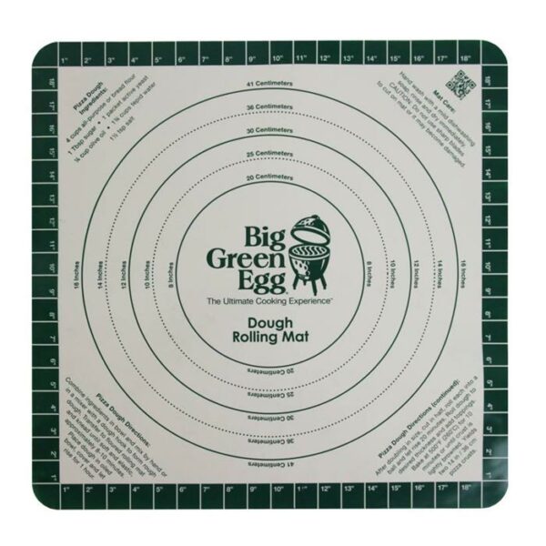 The Pizza Rolling Mat features concentric circles labeled in inches and centimeters, green Big Green Egg text at the center, measurement guides on the edges, and includes instructions plus a QR code in the corners.