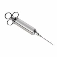 The BGE-Marinade Injector is a stainless steel syringe with finger rings and a long, sharp needle angled to the right, shown isolated on a white background.