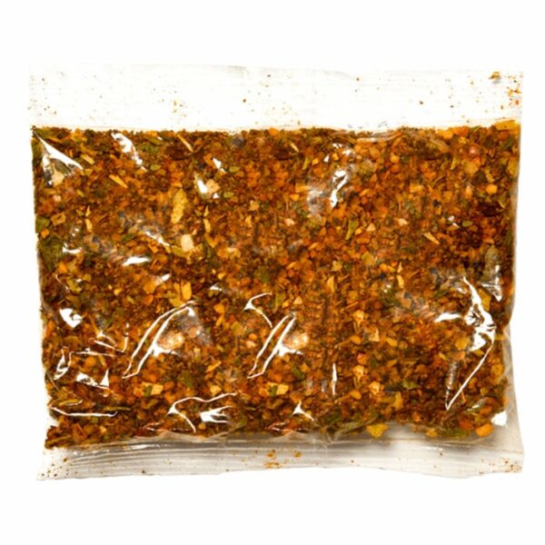 A sealed, clear plastic packet of Turkey Pellet Blend with Brine containing a colorful mix of dried herbs and spices with red, orange, brown, and green flecks.