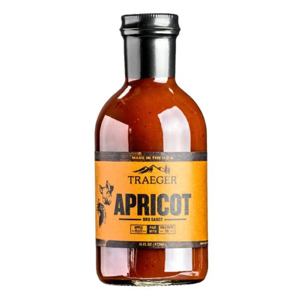 A glass bottle of Traeger Apricot BBQ Sauce with a black cap and an orange-and-black label featuring text and an apricot illustration.