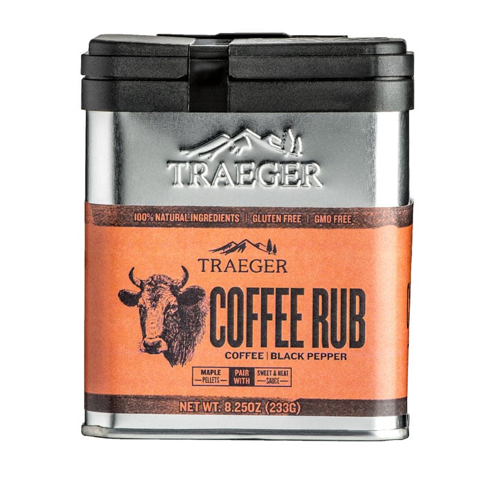 A metal container of Traeger Coffee Rub features an orange label with a bull illustration, highlighting coffee and black pepper flavors. The rub is gluten free and made with natural ingredients.