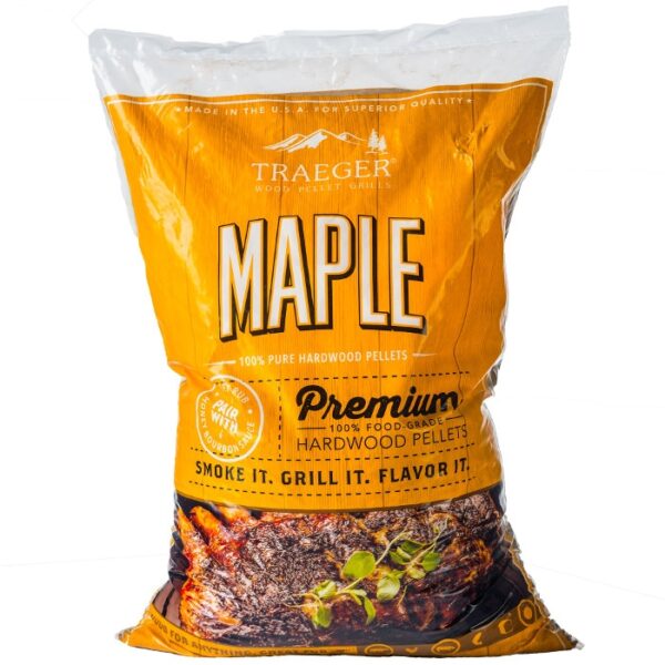 A bag of TRAEGER-Maple Pellets, with yellow and orange packaging, bold lettering, and an image of grilled meat garnished with herbs at the bottom.