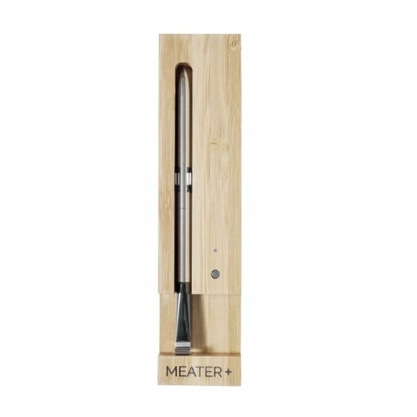 The TRAEGER-Meater+ WiFi Thermometer, featuring a sleek metallic probe stored in a wooden charging case labeled MEATER+, is displayed upright on a white background.