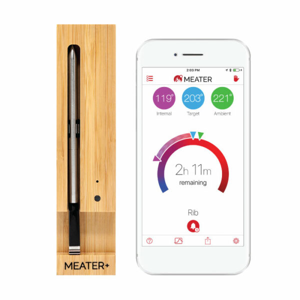 The TRAEGER-Meater+ WiFi Thermometer in a wooden case is pictured beside a smartphone showing the MEATER app, which displays internal, target, and ambient temperatures, remaining cook time, and rib as the selected meat.
