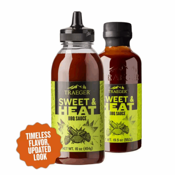 Two TRAEGER-Sweet & Heat 16 OZ Sqz bottles—one squirt bottle displayed in front of a standard bottle, both with green labels. An orange badge reads: Timeless flavor, updated look.