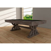 The BT-8ft Drummond Dark Chestnut pool table with its dark playing surface sits in a bright room with wooden floors, sunlight streaming through windows and highlighting lush greenery outside.