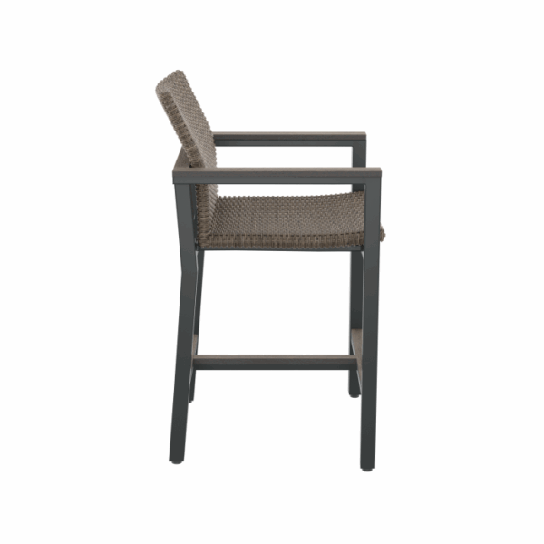 Side view of the Vail Spa Side Chair Brown featuring a woven brown seat and backrest, black metal frame with armrests and footrest, set against a plain white background.
