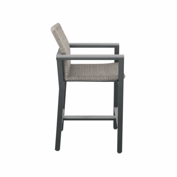 Side view of the Vail Spa Side Chair Grey featuring a gray woven seat and backrest, black metal frame with armrests and footrest, set against a white background.