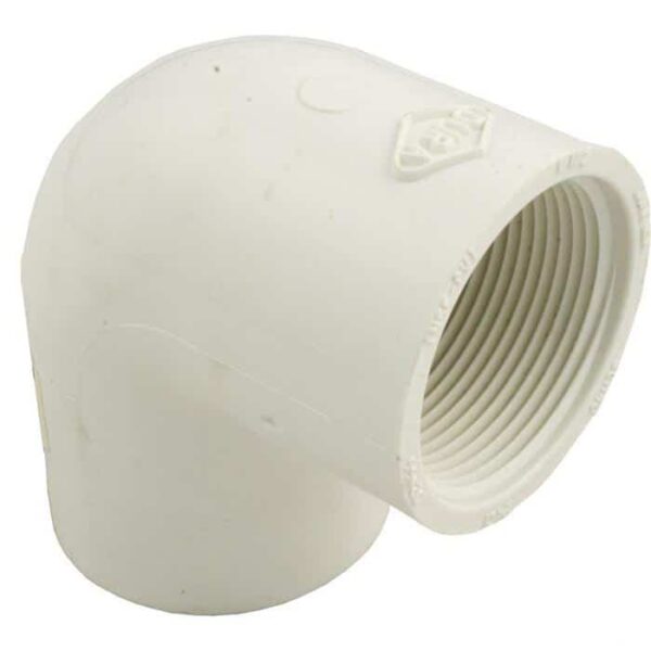 The Elbow, 90° 1-1/2 Slip x 1-1/2 FPT is a white PVC pipe fitting designed to connect two pipes at a 90-degree angle, featuring one slip end and one female threaded end.