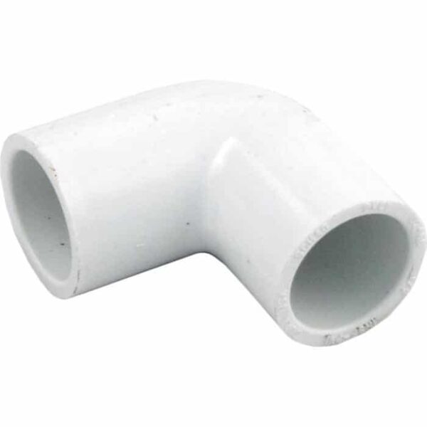 The Elbow, 90° 1/2 Slip x 1/2 Slip is a white PVC fitting designed to join two pipes at a 90-degree angle.