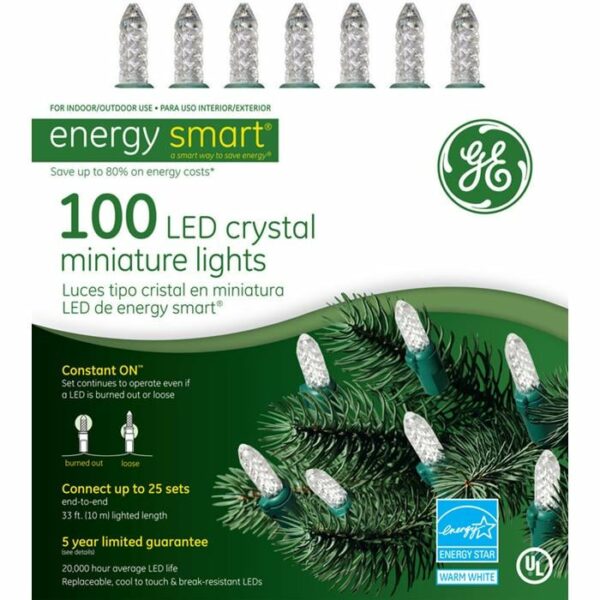 A box of Energy Smart 100 LED Crystal Miniature Light Set - White, with images of the lights and a pine branch, highlights energy savings, constant on technology, and includes a 5-year limited guarantee.