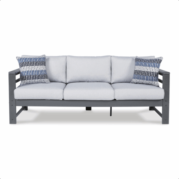 The Amora Grouping 4-piece is a modern gray outdoor sofa featuring a dark metal frame, three seat and back cushions, and two patterned throw pillows, showcased against a plain white background.
