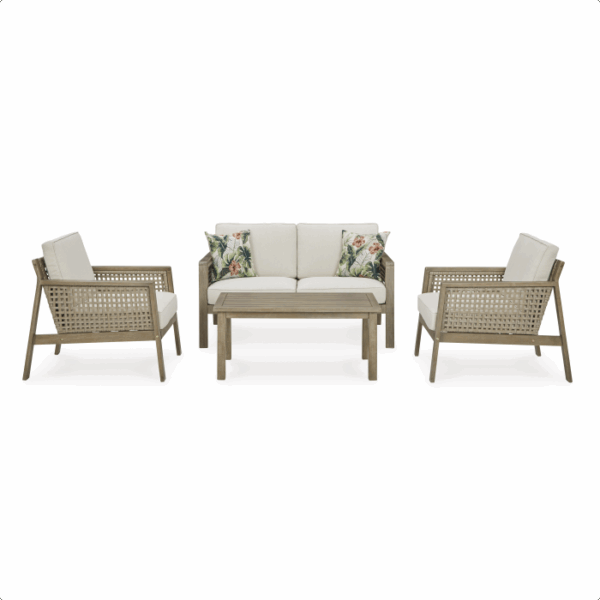 The Barn Cove Grouping 4-piece set features light wood frames, beige cushions, a loveseat with two floral throw pillows, two armchairs, and a rectangular coffee table.