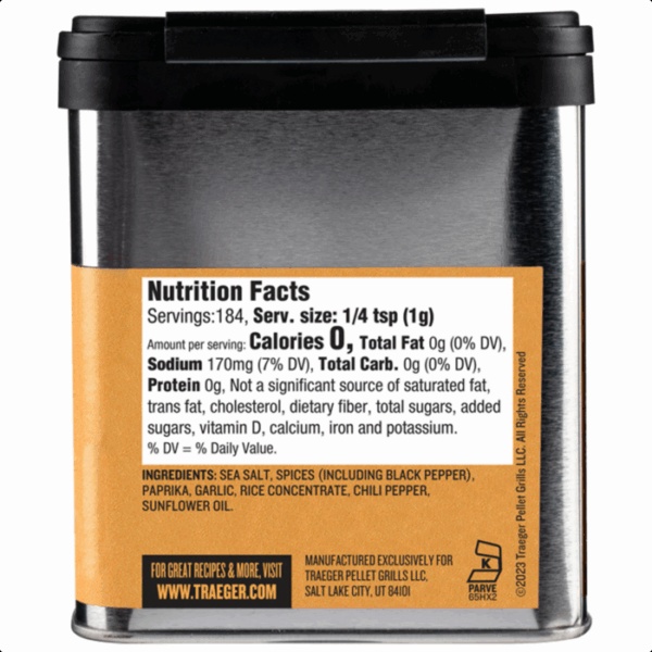 A metal Traeger FAJITA SEASONING container features a nutrition facts label, ingredients, and manufacturer info on an orange and white back panel, with traeger.com printed at the bottom.