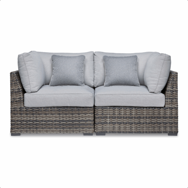 The Harbor Court Grouping 7-piece features a modern outdoor loveseat with a woven rattan base, light gray seat and back cushions, and two textured gray throw pillows, displayed against a white background.