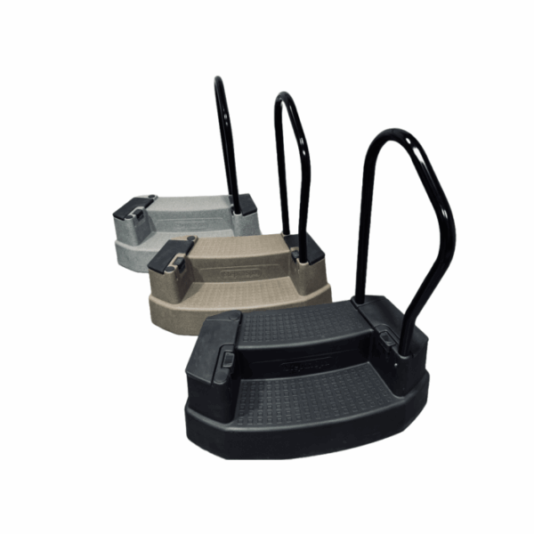 Three INNOVASTEP FROST portable RV steps in gray, tan, and black, each featuring a textured surface and a sturdy black handrail on one side, are arranged in a staggered formation against a white background.