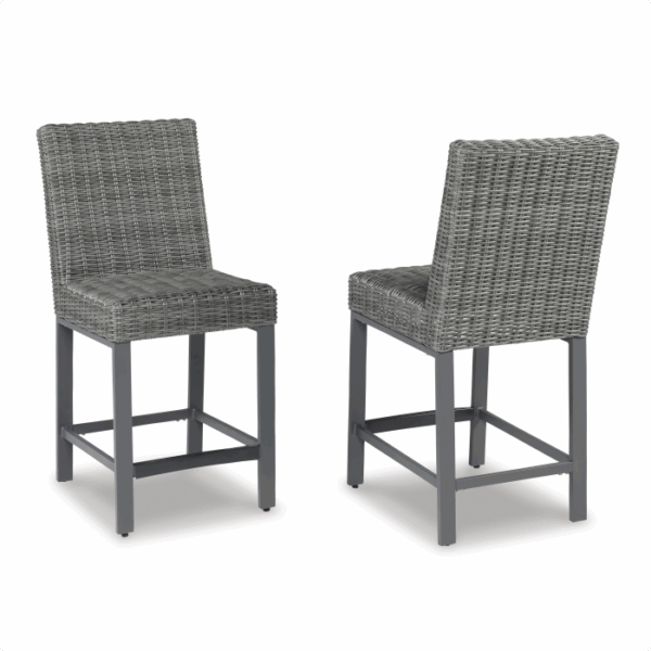 The Palazzo Hill Bar Set 7-piece features two gray wicker barstools with metal legs, woven backs and seats, front and back views shown. Each stool includes a footrest and showcases a modern, sturdy design.