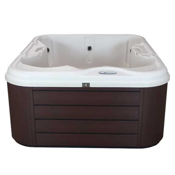 The Retreat All-In-110V hot tub features a Shadow Shell (white interior) and Charcoal Cabinet (dark brown exterior), viewed from the front, with built-in seats and water jets.