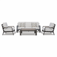 The Tropicava Grouping 4-piece is a modern outdoor set featuring a three-seat sofa with two patterned accent pillows, two armchairs, and a rectangular coffee table. All pieces have dark frames and light-colored cushions.