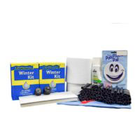 The Medium Round Winter PCKG-STD includes two yellow and blue boxes, a pool pillow, black tubes, a white bottle, a towel, and assorted pool maintenance items arranged together.
