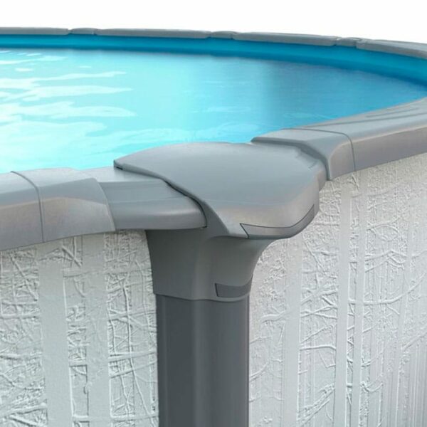 Close-up of the 12 x 23 x 54 Serenity Pool Package shows blue water, a textured white exterior, and gray plastic top rails and support posts.